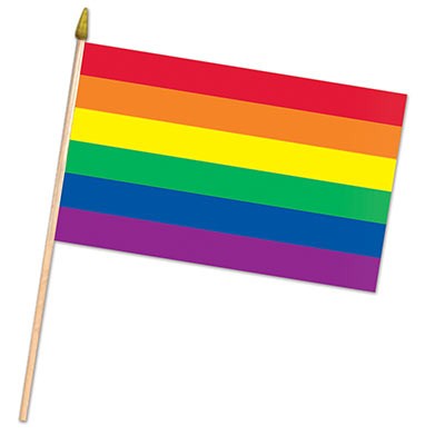 Fabric flag printed with rainbow stripes and attached to wooden sticks.