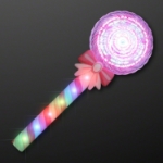 11.8" Deluxe Light Up Spinning Lollipop Wand (Pack of 12) 11.8" Deluxe Light-Up Spinning Lollipop Wand with chasing-lights handle and spinning LED top. Easy ON button activation and includes 3 replaceable AA batteries. Pack of 12—great for parties, festivals, and nighttime events.