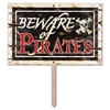 Plastic Beware Of Pirates Yard Sign that looks like worn wood with the saying "Beware of Pirates" and a skull and bone design.