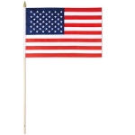 Fabric material American printed flag attached to a wooden stick.