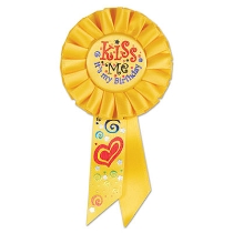Kiss Me, It's My Birthday Yellow Rosette has multi colors of metallic lettering with heart/swirl designs