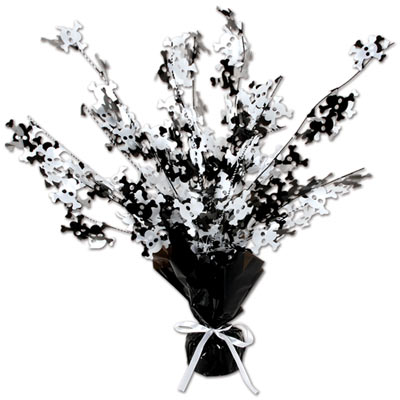 Weighed down black centerpiece with cascading metallic strands and wired skulls and bones