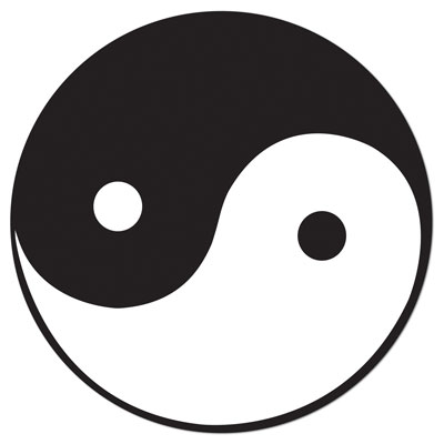 A yin yang cutout in black and white printed on card stock material.