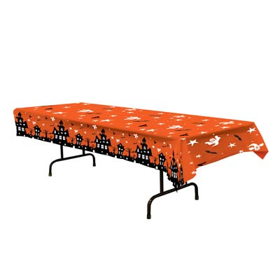 Halloween table over with haunted houses and ghosts on an orange background