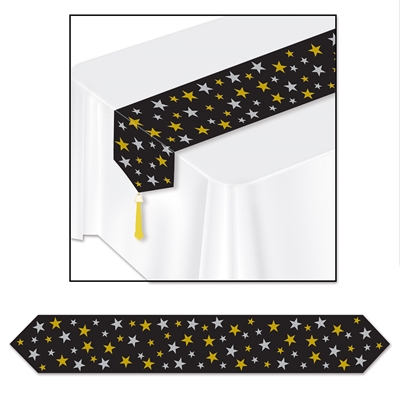 Black table runner with silver and gold printed stars and each end adorned with a gold tassle. 