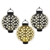 Light-up paper lanterns in black and gold with white stars 