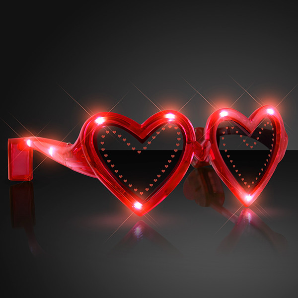 Heart Shaped Red Light Up Novelty Sunglasses. These Heart Shaped Light up sunglasses are perfect for glow in the dark parties.