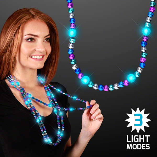 Turquoise LED Beaded Necklace with three light modes. These turquoise LED necklaces are the perfect addition to your party outfit of the night.