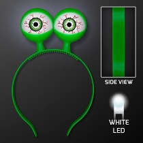 Green headband with flashing alien eyes. 
