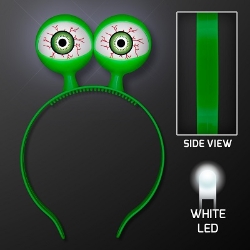 Green headband with flashing alien eyes. 