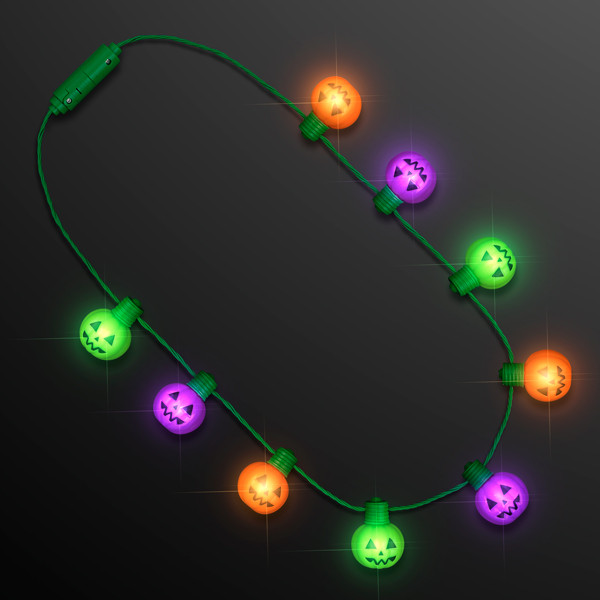 Necklace with light up pumpkins in green, purple and orange. 