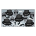 Black and white NYE party assortment of chairman hats, fringed tiaras, beads and horns. 