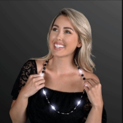 Black beads with white pieces that light up.