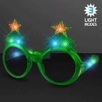 Light Up Christmas Tree Novelty Sunglasses w/ Three Light Modes. These Christmas Tree Light Up Sunglasses will add just the flare you need for your Holiday party outfit.